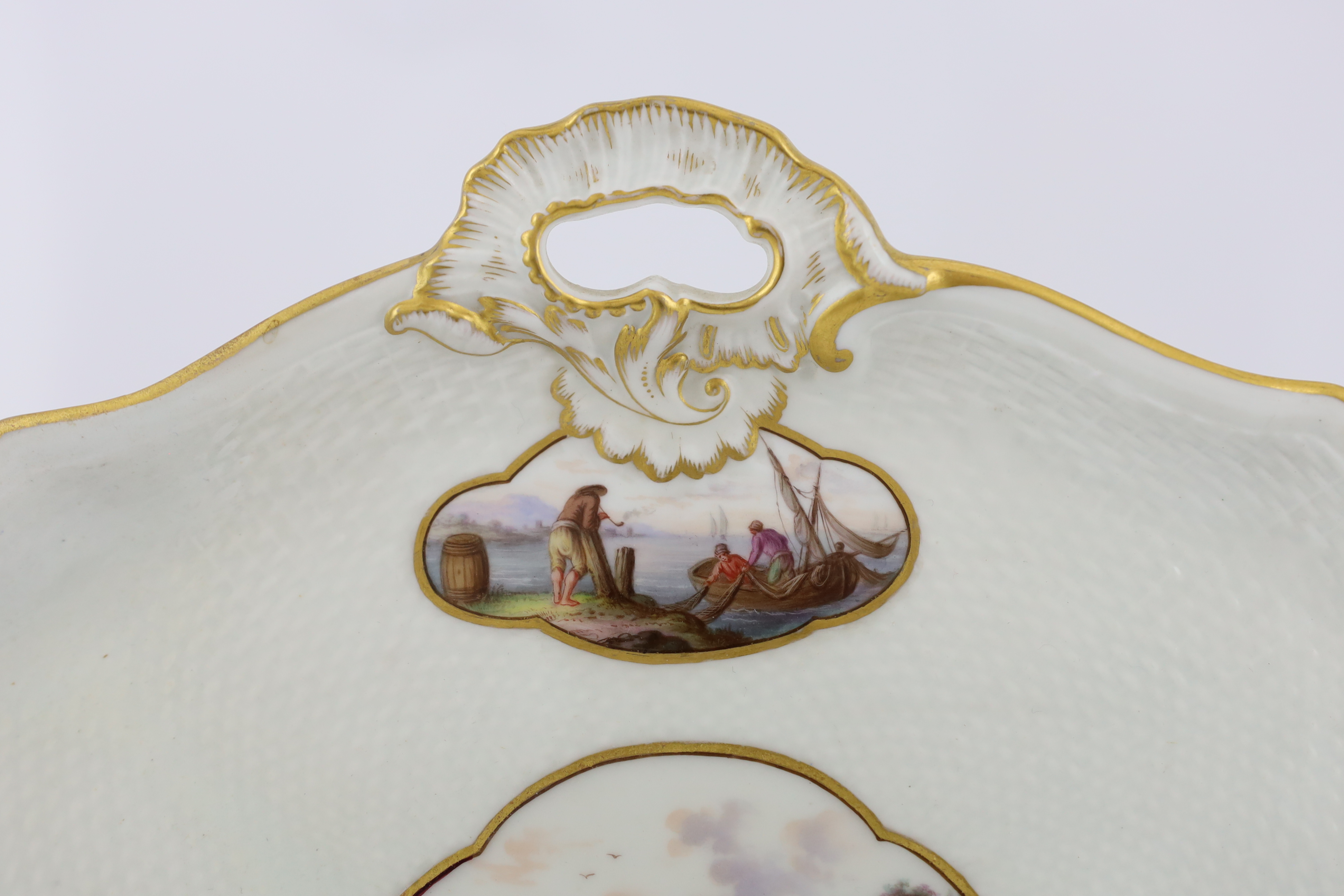 A Meissen porcelain lozenge shaped tray, 19th century, broken and restored